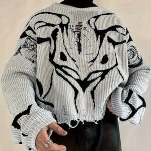 Pull tricoté déchiré